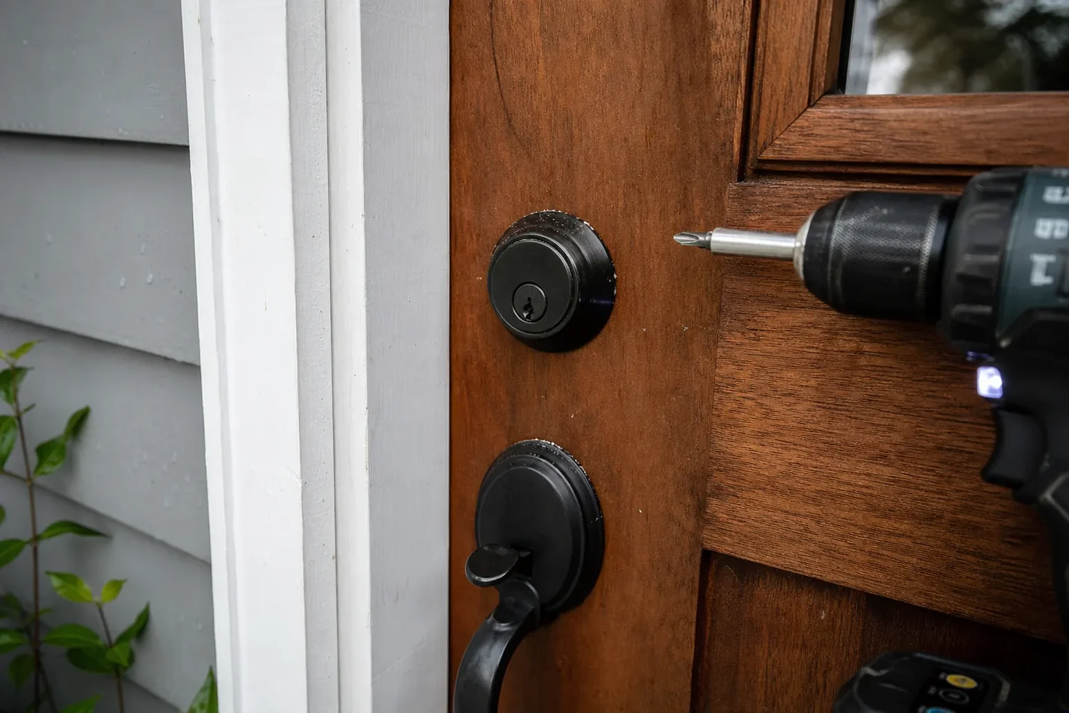 New deadbolt being installed in a front door